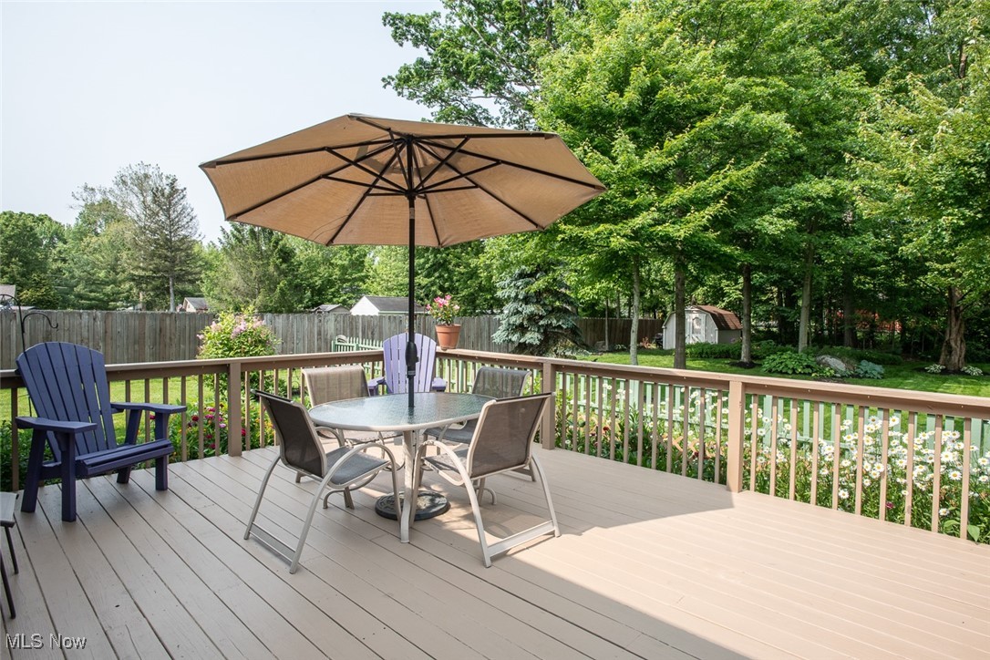 126 Timber Ridge Drive Elyria, OH 44035 - Photo 25 of 49 Wooden deck with a fenced backyard and outdoor dining area