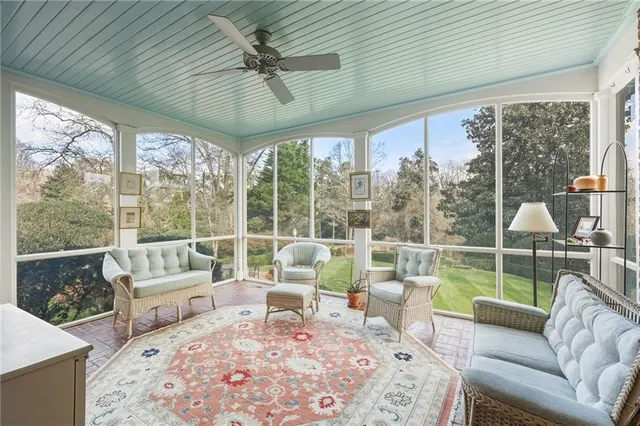 a bedroom with furniture and a window