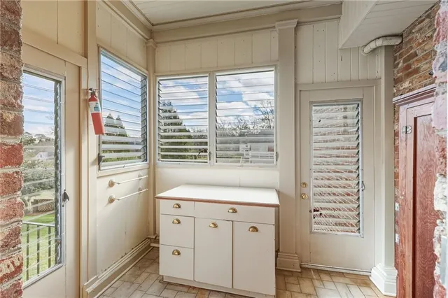 a bedroom with a bed couch and a window