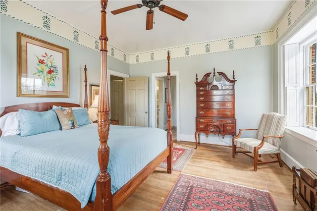 a bathroom with a granite countertop sink a toilet and a mirror