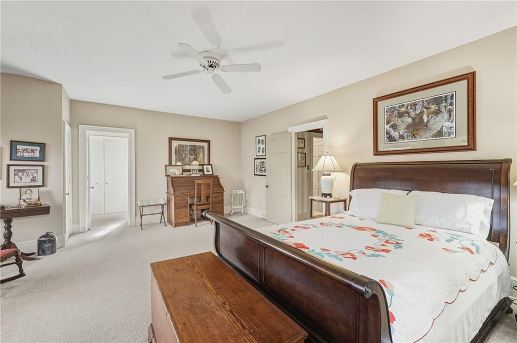 1606 Riverside Drive Gainesville, GA 30501 - Photo 30 of 55 a bedroom with a bed and wooden floor