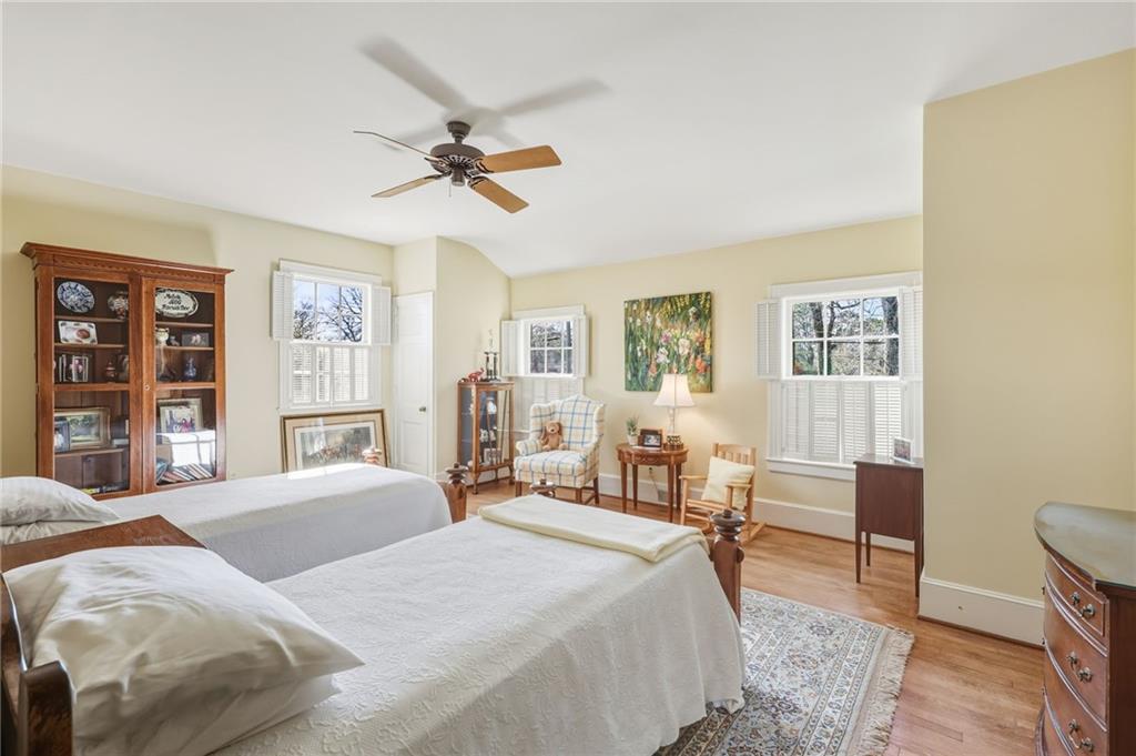 1606 Riverside Drive Gainesville, GA 30501 - Photo 34 of 55 a bedroom with a bed and wooden floor