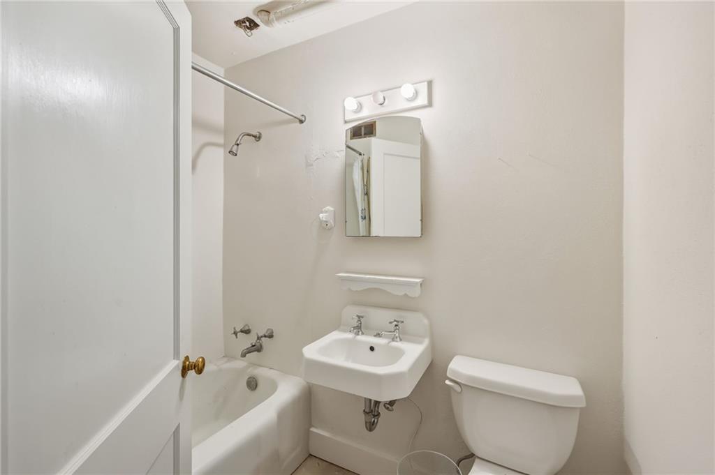 1606 Riverside Drive Gainesville, GA 30501 - Photo 38 of 55 a bathroom with a sink a toilet and shower