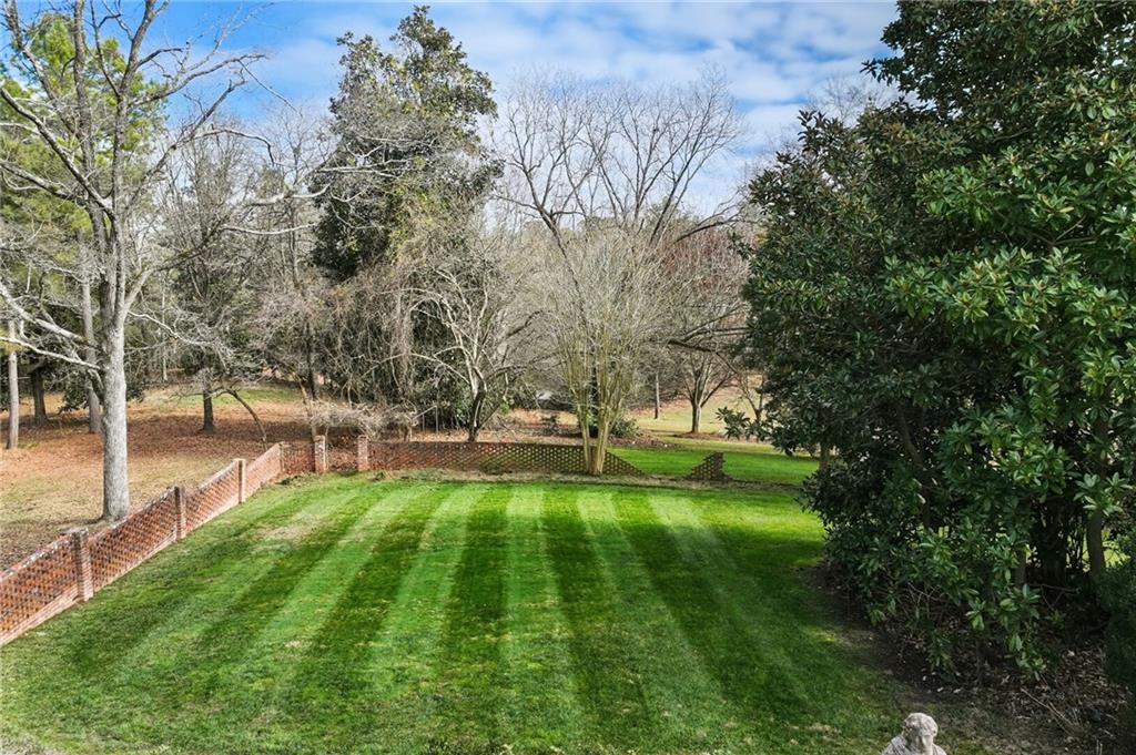 1606 Riverside Drive Gainesville, GA 30501 - Photo 43 of 55 a swimming pool with lots of tress in front of it