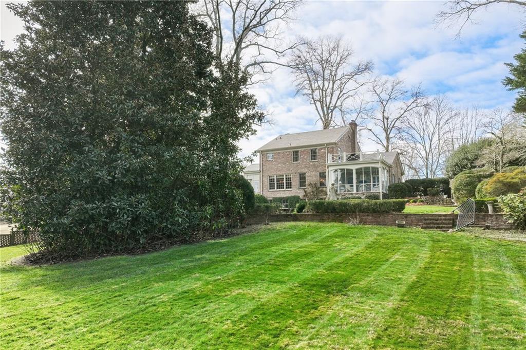 1606 Riverside Drive Gainesville, GA 30501 - Photo 44 of 55 a view of a house with a big yard and large trees
