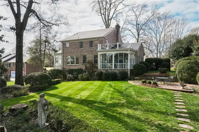 a view of a house with a snow in the yard
