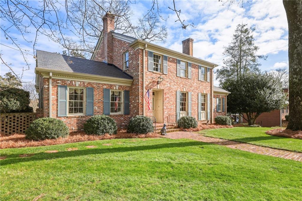 1606 Riverside Drive Gainesville, GA 30501 - Photo 5 of 55 front view of a brick house with a yard