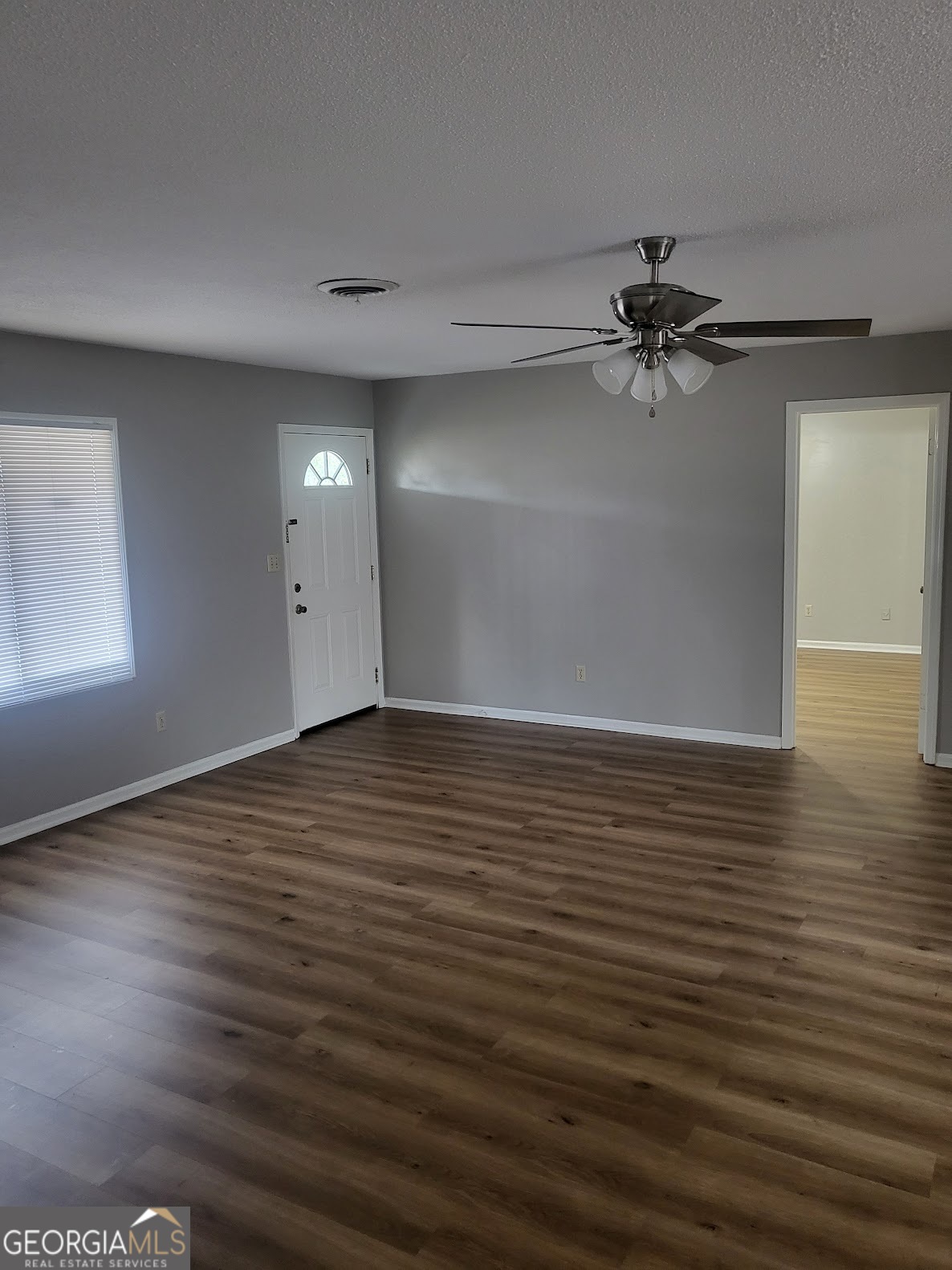 1207 Firestone Drive Albany, GA 31707 - Photo 2 of 15 wooden floor in an empty room