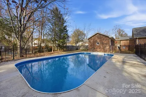 a view of a swimming pool with a patio