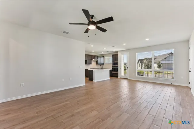 a view of kitchen with wooden floor