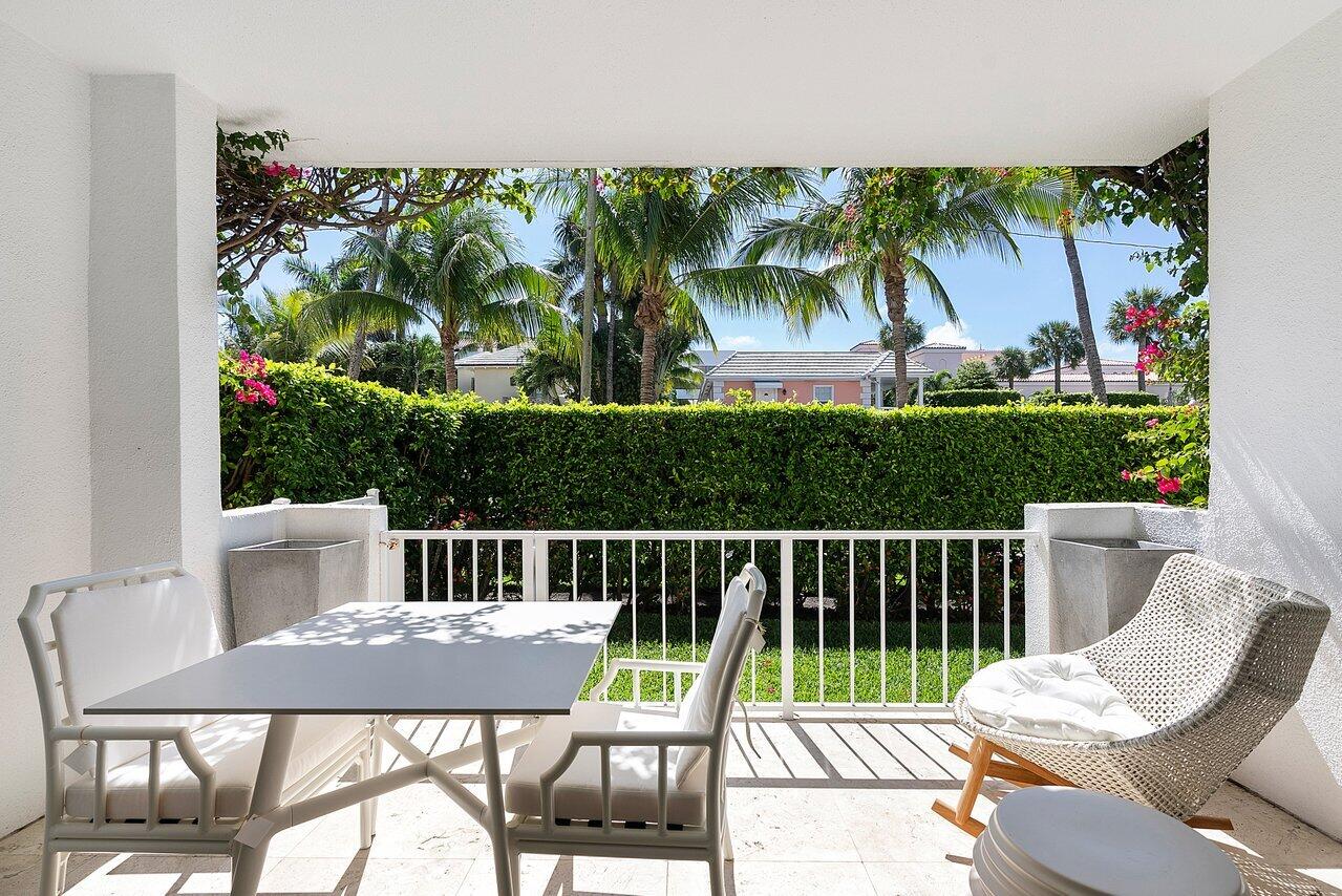 127 Peruvian Avenue, Unit 101 Palm Beach, FL 33480 - Photo 16 of 16 a view of a chairs and table in patio