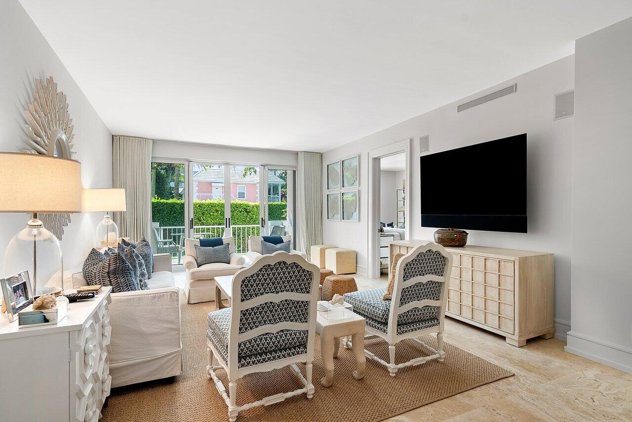 127 Peruvian Avenue, Unit 101 Palm Beach, FL 33480 - Photo 2 of 16 a living room with furniture and a flat screen tv