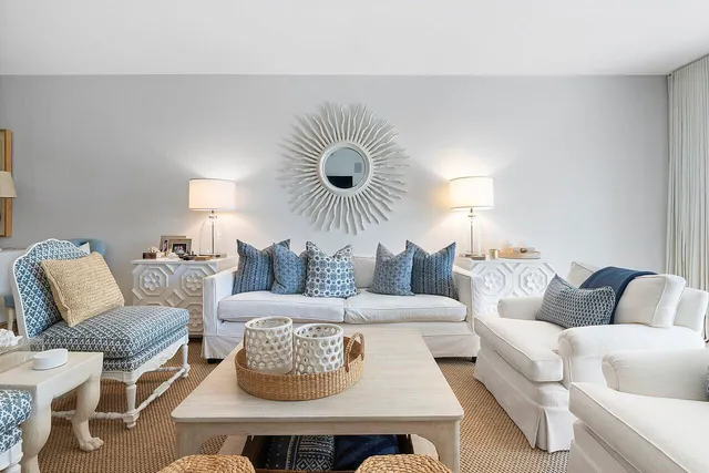 a living room with furniture a rug and a fireplace