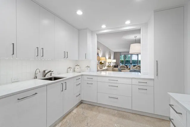 a kitchen with a sink and cabinets