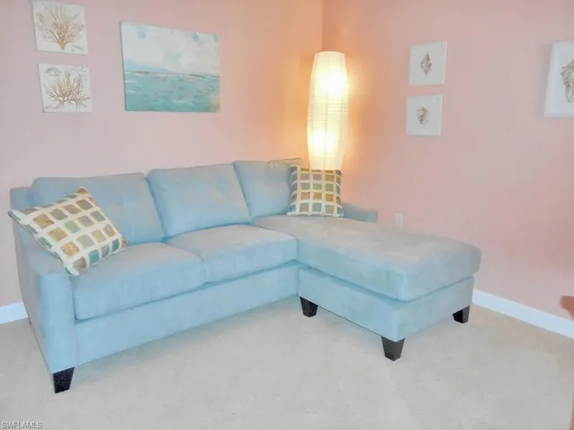 a living room with furniture and a couch