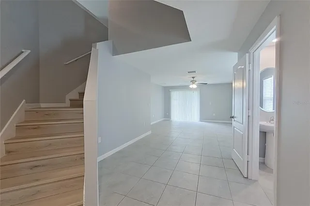a view of a hallway with closet and entryway