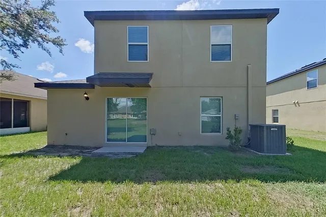 a house view with a backyard space