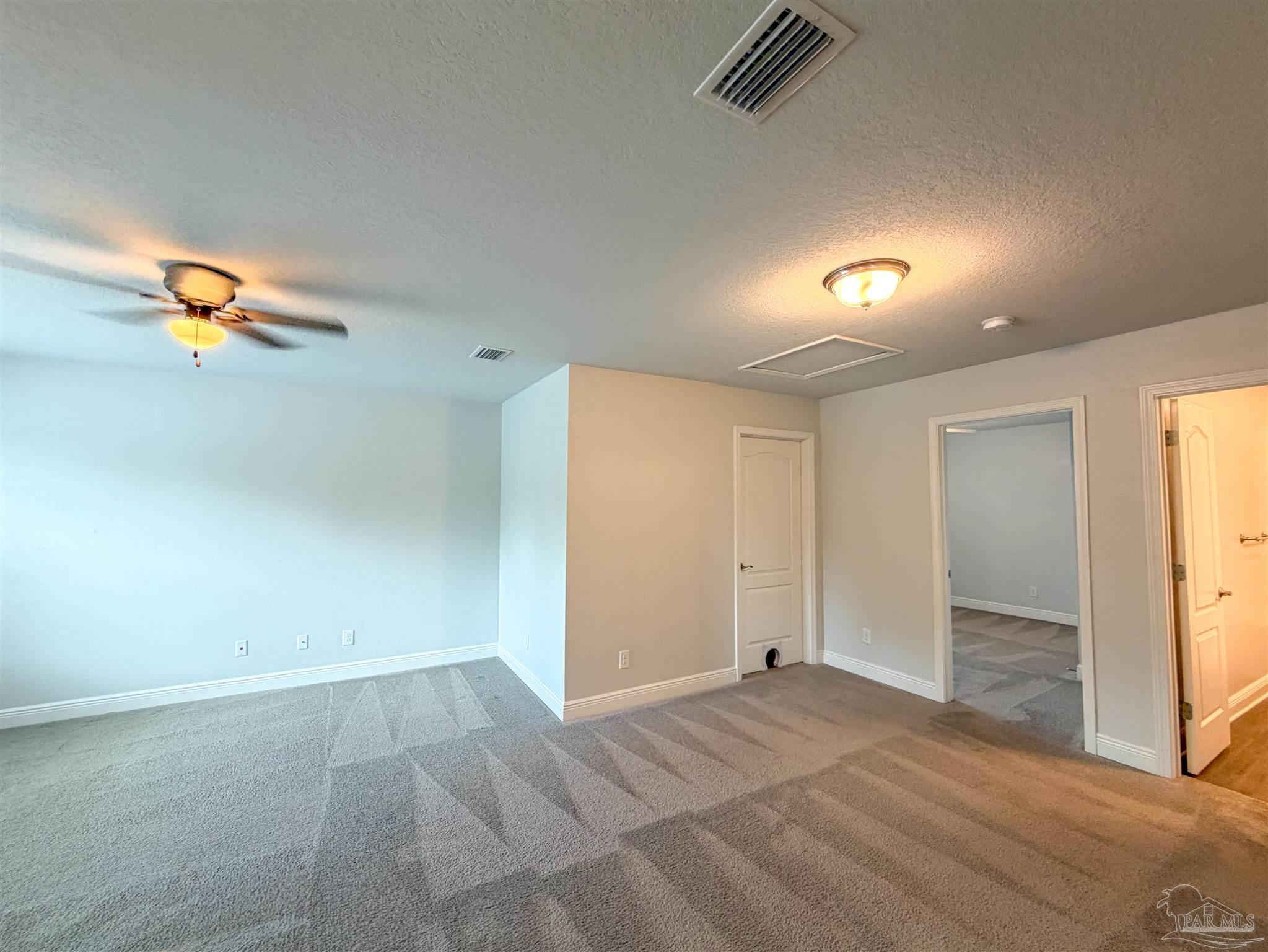 3613 Conley Drive Cantonment, FL 32533 - Photo 18 of 32 an empty room with a empty space and windows