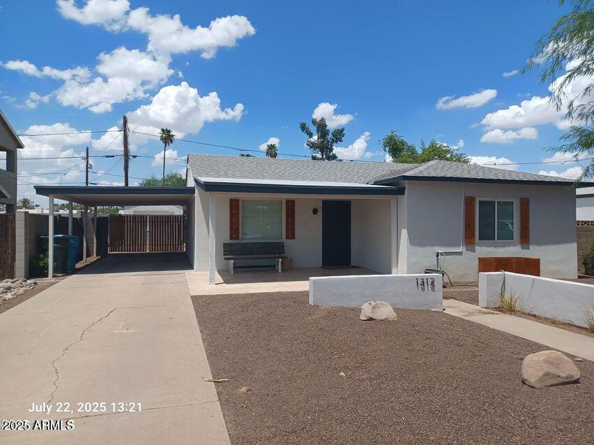 a front view of a house with a yard and a garage