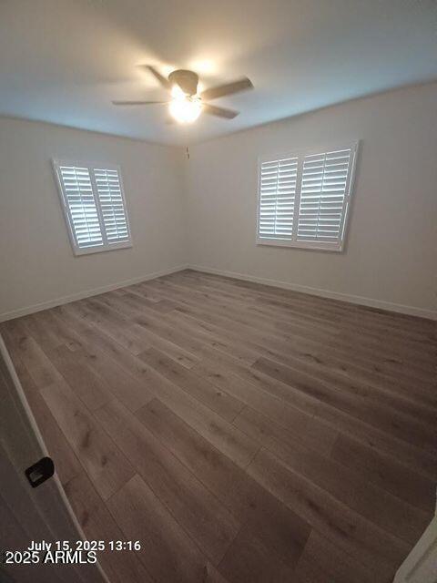 1312 West Roma Avenue Phoenix, AZ 85013 - Photo 16 of 17 an empty room with windows and fan