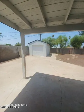 a view of a backyard of the house