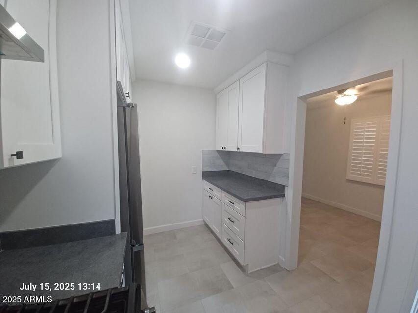 1312 West Roma Avenue Phoenix, AZ 85013 - Photo 7 of 17 a kitchen with a stove and a refrigerator