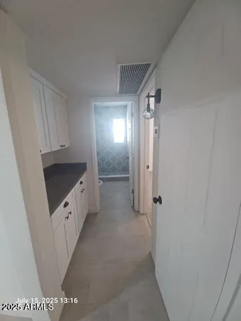 a bathroom with a double vanity sink and mirror