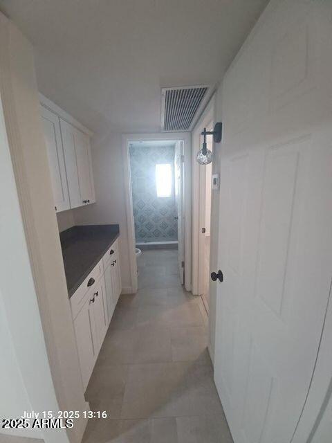 1312 West Roma Avenue Phoenix, AZ 85013 - Photo 8 of 17 a bathroom with a double vanity sink and mirror