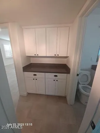 a view of cabinets and a sink