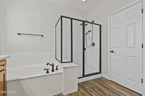a bathroom with a shower and a tub