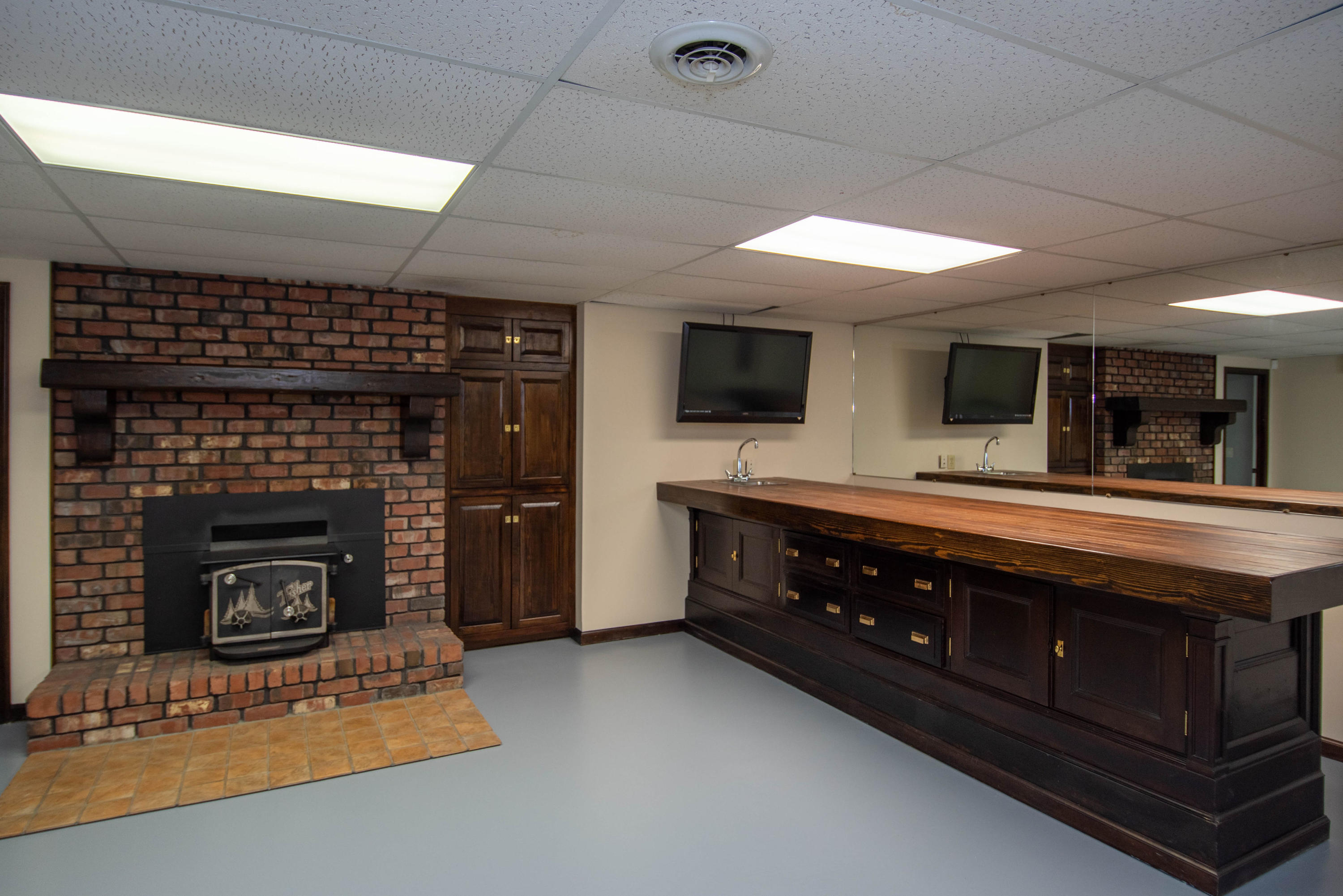 5308 McCall Road Rincon, GA 31326 - Photo 23 of 35 Wet bar, media center and chimney set the mood for carousing!