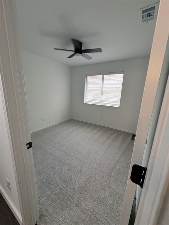 533 Bowie Street Forney, TX 75126 - Photo 5 of 7 an empty room with windows and entrance