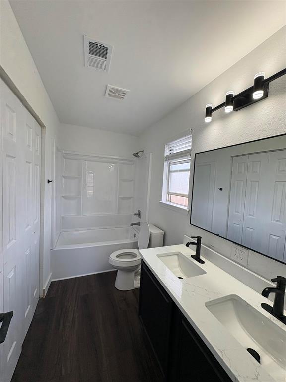 533 Bowie Street Forney, TX 75126 - Photo 6 of 7 a bathroom with a sink and a mirror