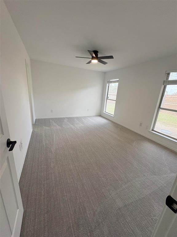 533 Bowie Street Forney, TX 75126 - Photo 7 of 7 an empty room with windows and entrance