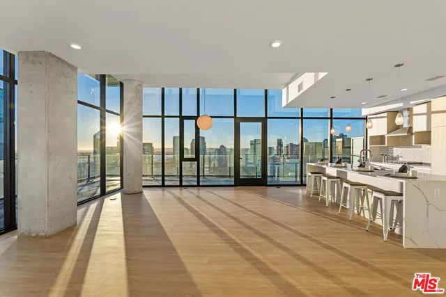a view of a large kitchen with a large window