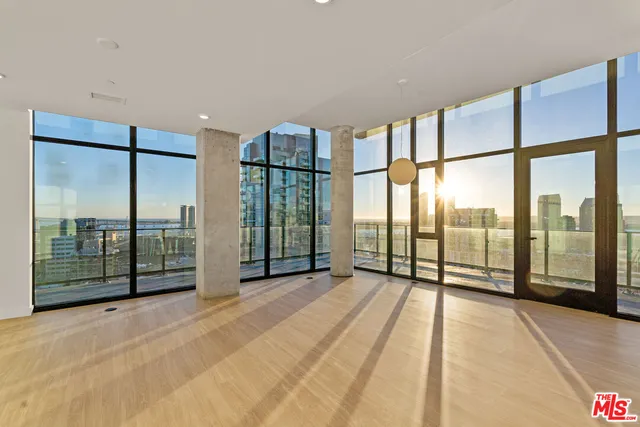 a view of an empty room with windows
