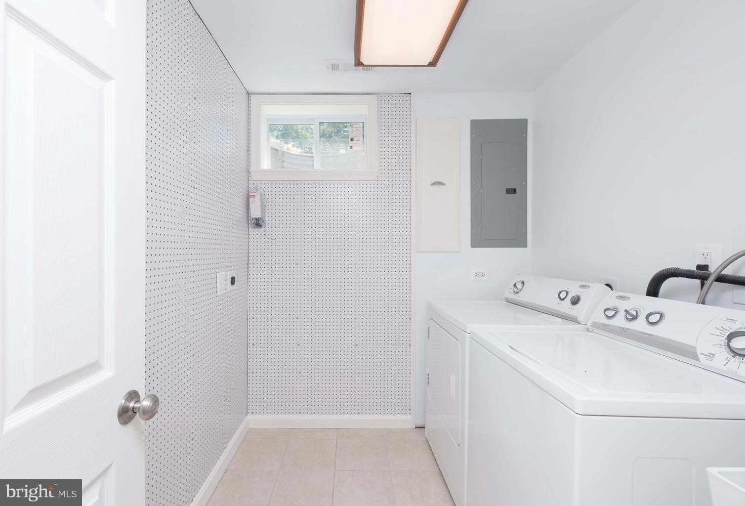 2901 Marsala Court Woodbridge, VA 22192 - Photo 27 of 30 Laundry room with pegboard wall, ceramic tile