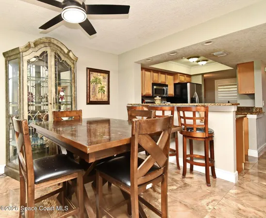 a view of kitchen counter and kitchen cabinets