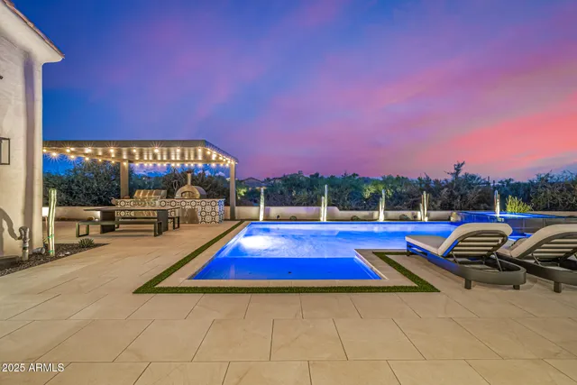 a living room with furniture a rug and a flat screen tv