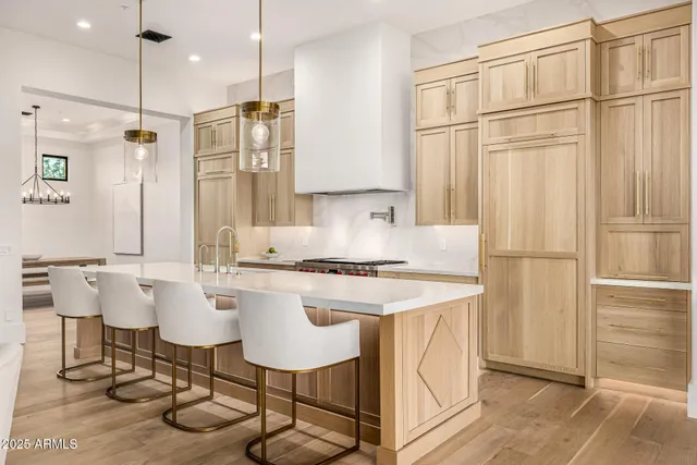 a view of an empty room with a window and a fireplace