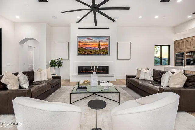 a bathroom with a toilet a sink a glass door a shower and a mirror