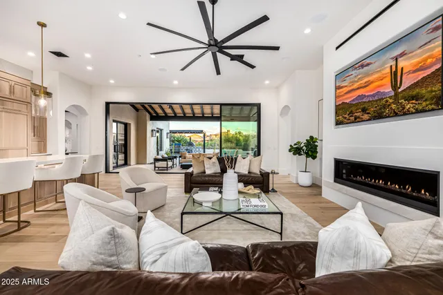 a bedroom with a bed wooden floor and window