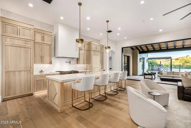 a view of an outdoor sitting area with furniture and a fireplace
