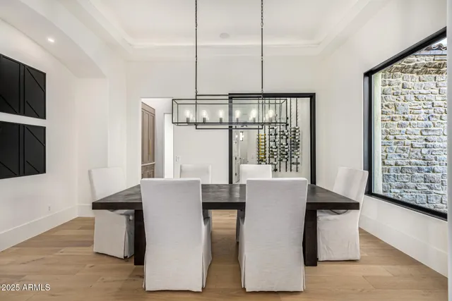 a spacious bedroom with a bed and a flat screen tv