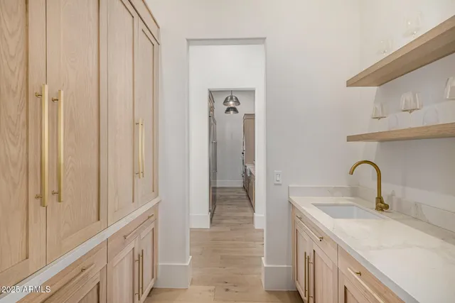 a view of entryway with wooden floor and a front door
