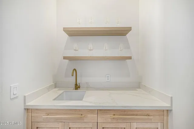 a view of a hallway with wooden floor and entryway
