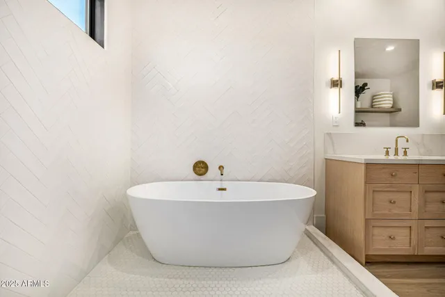 a view of a house with pool lawn chairs and a dining table