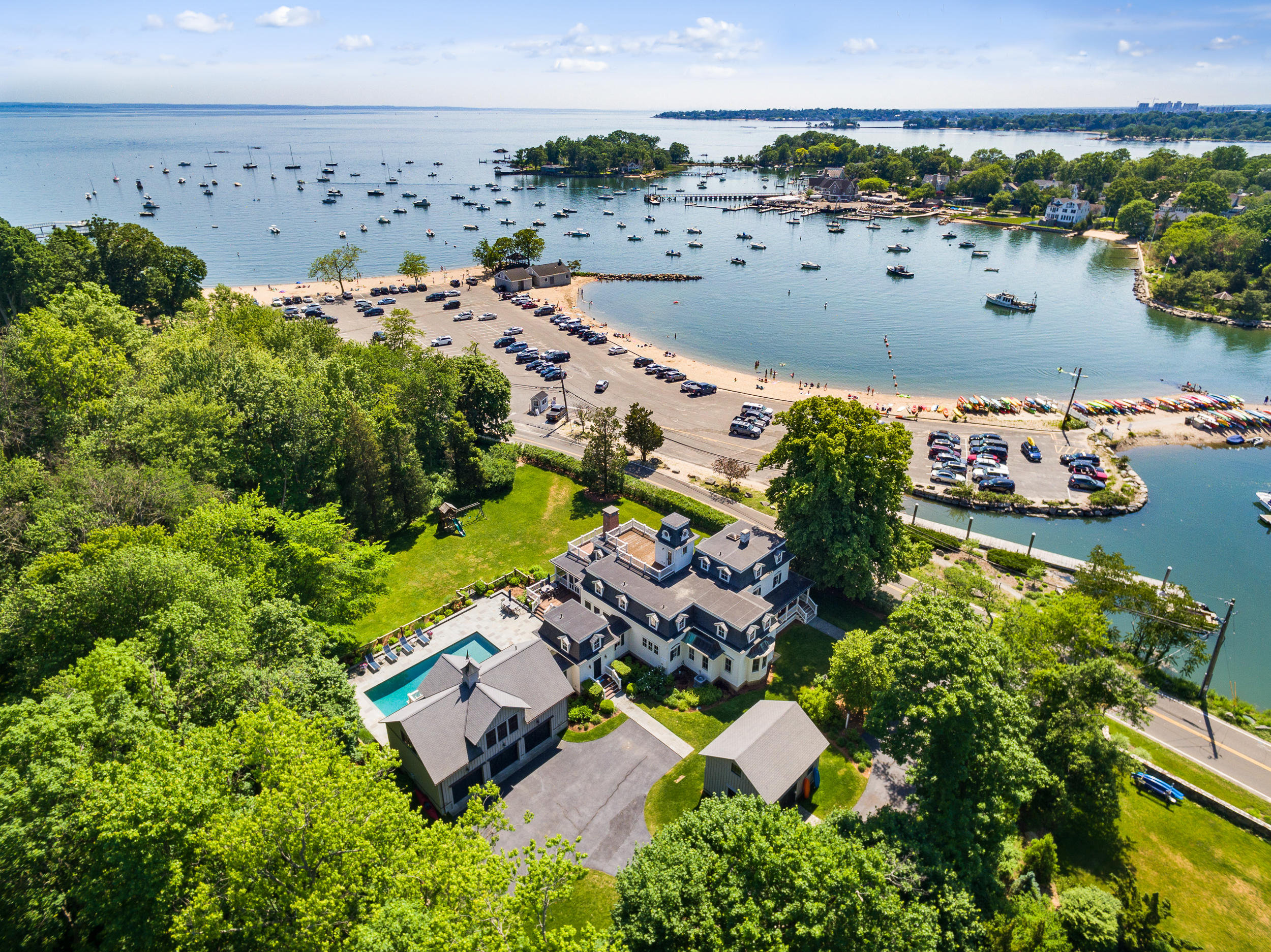136 Pear Tree Point Road Darien, CT 06820 - Photo 2 of 56 an aerial view of a house with a lake view