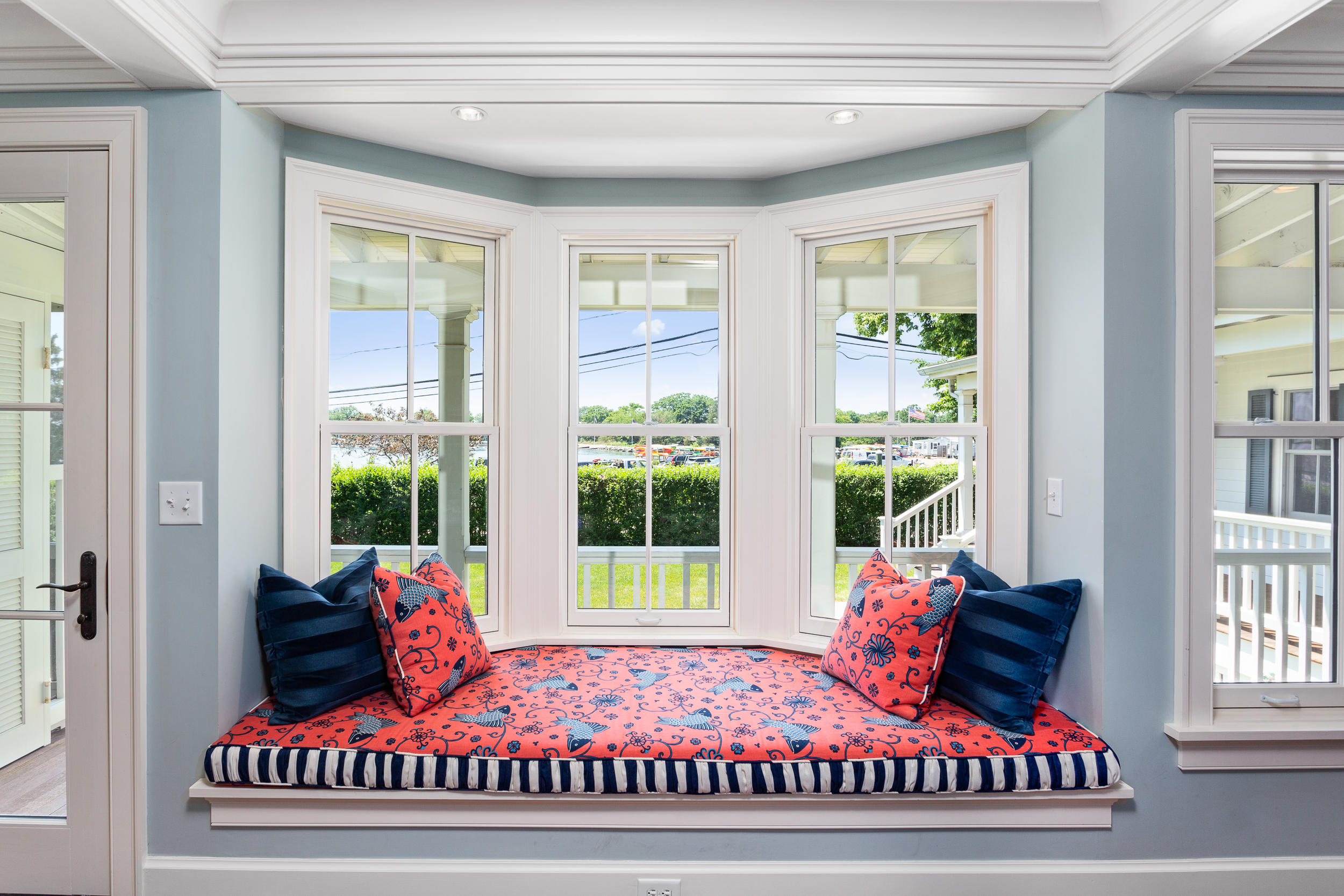 136 Pear Tree Point Road Darien, CT 06820 - Photo 23 of 56 a view of a bedroom with wooden floor and windows
