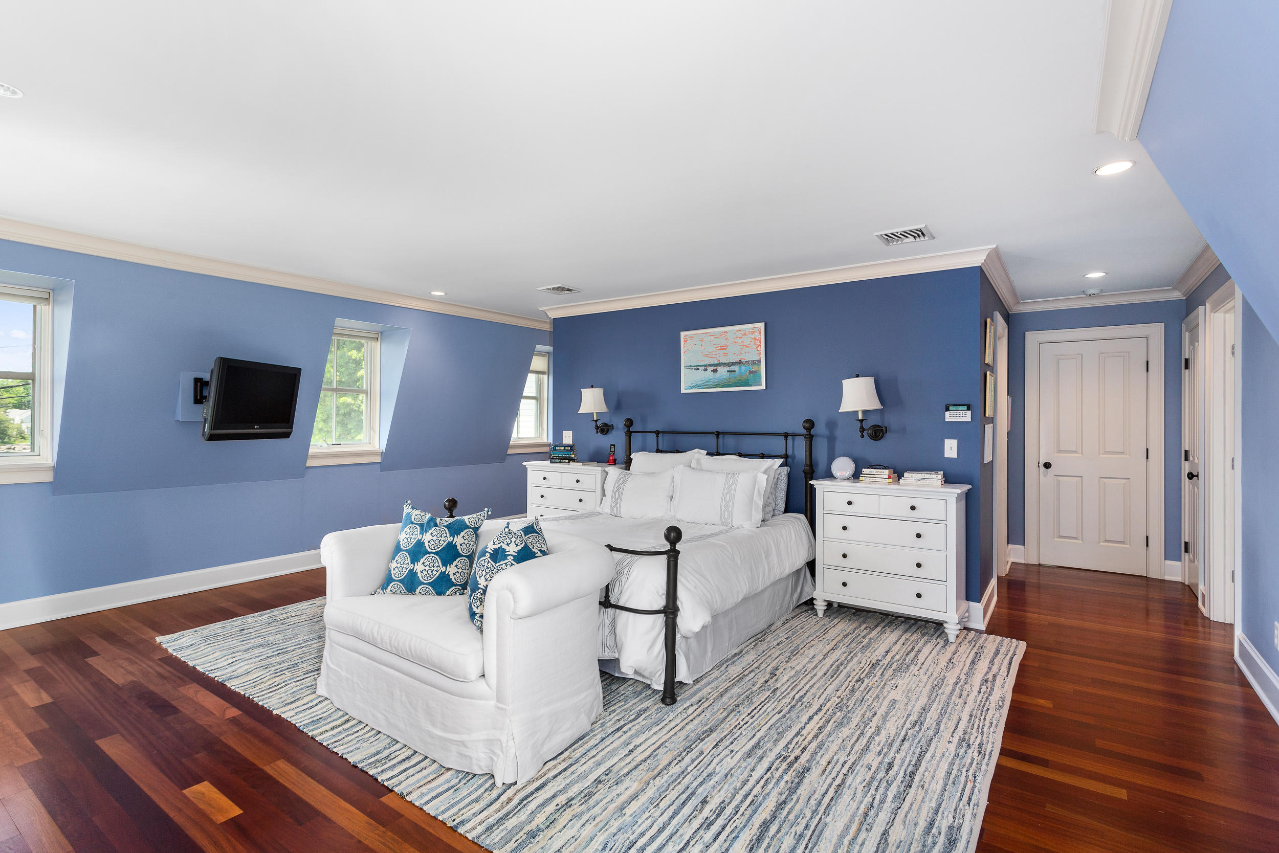 136 Pear Tree Point Road Darien, CT 06820 - Photo 26 of 56 a living room with furniture and a flat screen tv